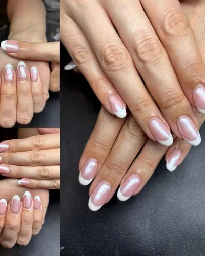 A classic French manicure on almond-shaped gel nails with a pearly pink base